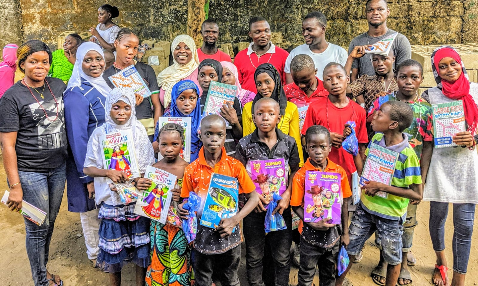 Students receiving books and learning materials